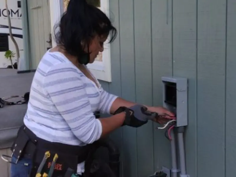 Licensed electrician wiring an exterior subpanel in Medway